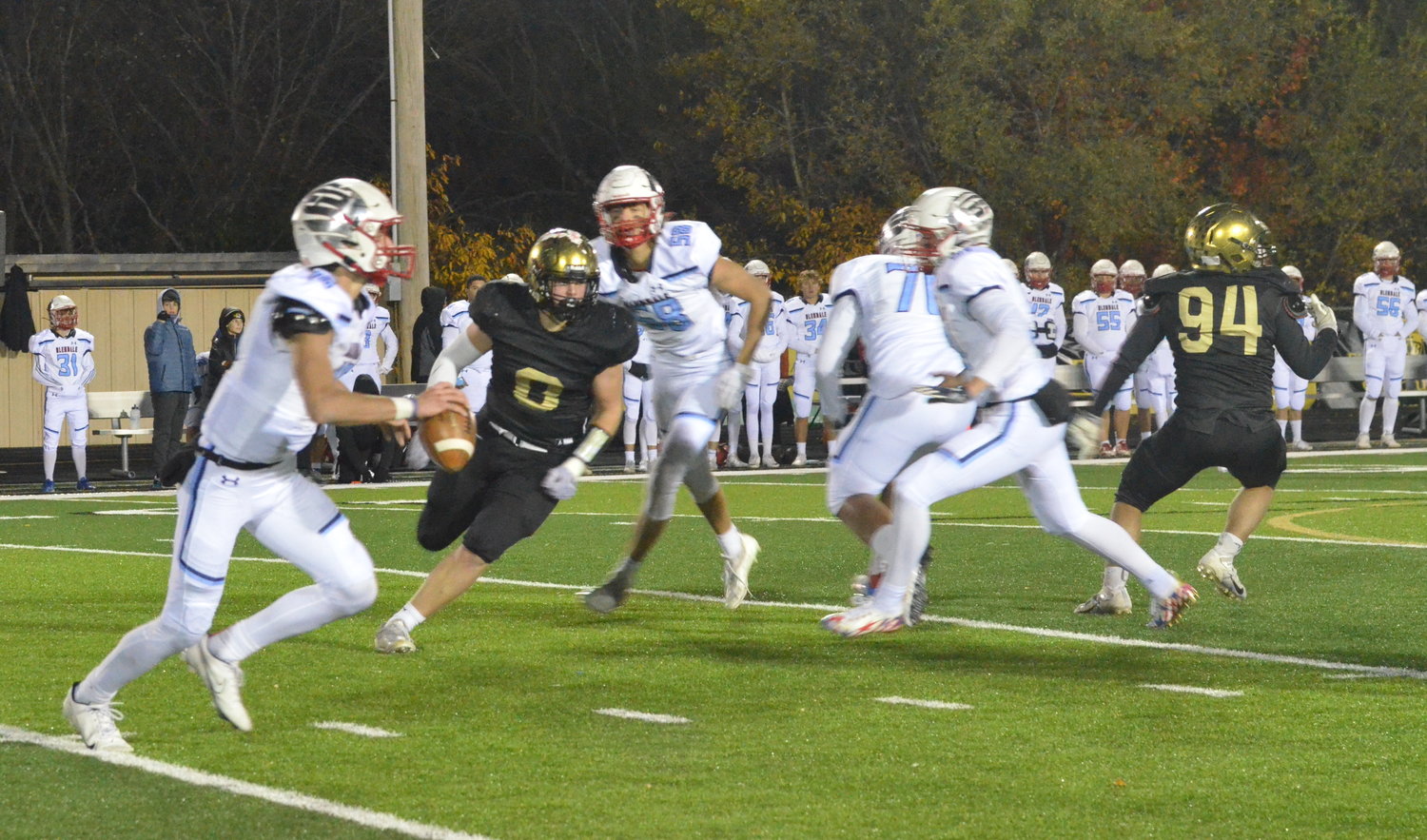 LCR photo/Alex Boyer
Lebanon sophomore Gunner Williams (8) runs down Glendale quarterback Cole Feuerbacher (16) during the Class 5 District 5 semifinal game on Friday night.